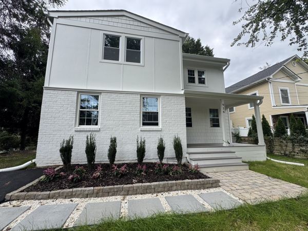 Rebuilt 1937 Cape Cod with new siding, roof and landscaping