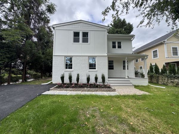 Private driveway and level front lawn