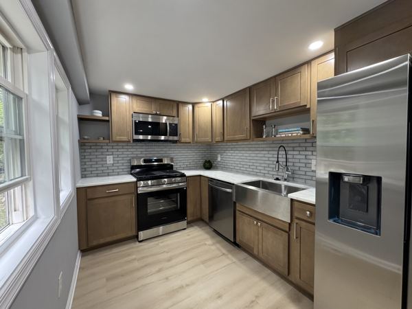 Kitchen with new stainless appliances and shaker cabinets