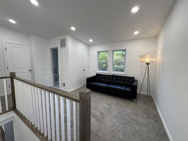 Upper-level loft overlooking the stairs