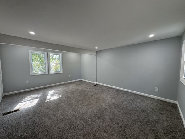Upper-level bedroom with new carpet